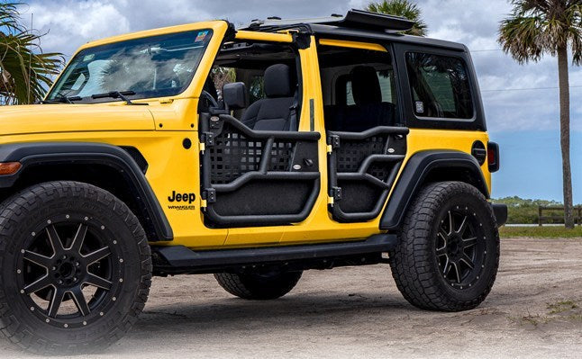 Yellow Jeep with black Alpha doors and all-weather panels installed, showing trail-ready style and off-road durability.