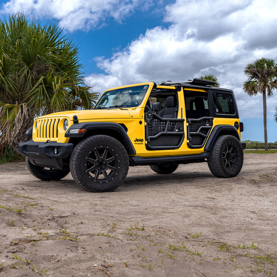 Yellow 4-door Jeep with Alpha tube doors and all-weather panels, showing durable, off-road-ready protection.