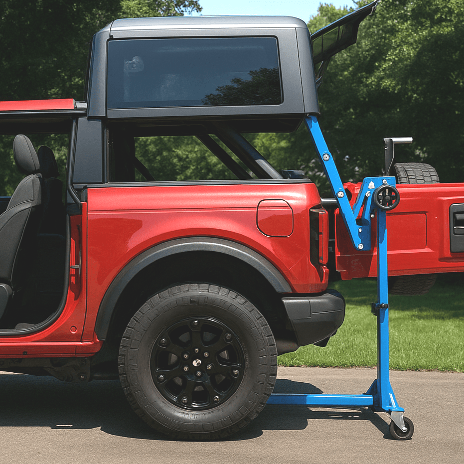 Red Ford Bronco with hard top lift tool under roof panel for no-tools, one-person hard top removal.
