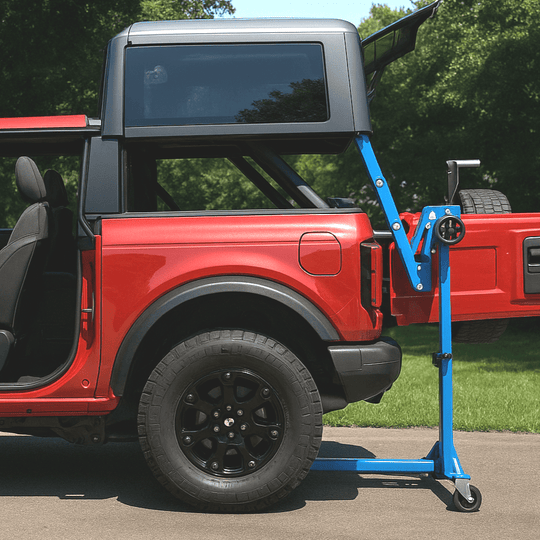 Red Ford Bronco with hard top lift tool under roof panel for no-tools, one-person hard top removal.