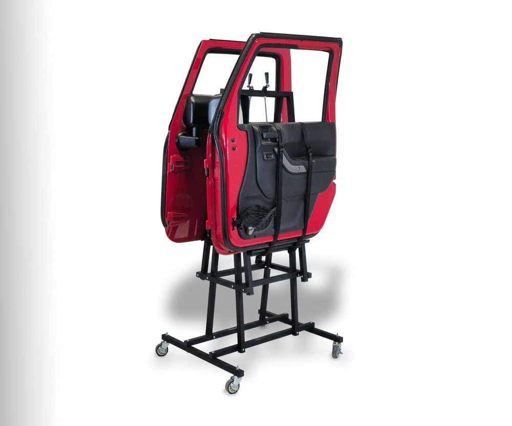 Angled view of EZ4X4 EZ Door Lift securing red Jeep doors against white background, showing safe vertical storage solution.