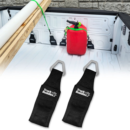2-pack Truck Buddiez Bed Anchor straps with logo securing red cooler to truck tailgate for secure, stable transport.