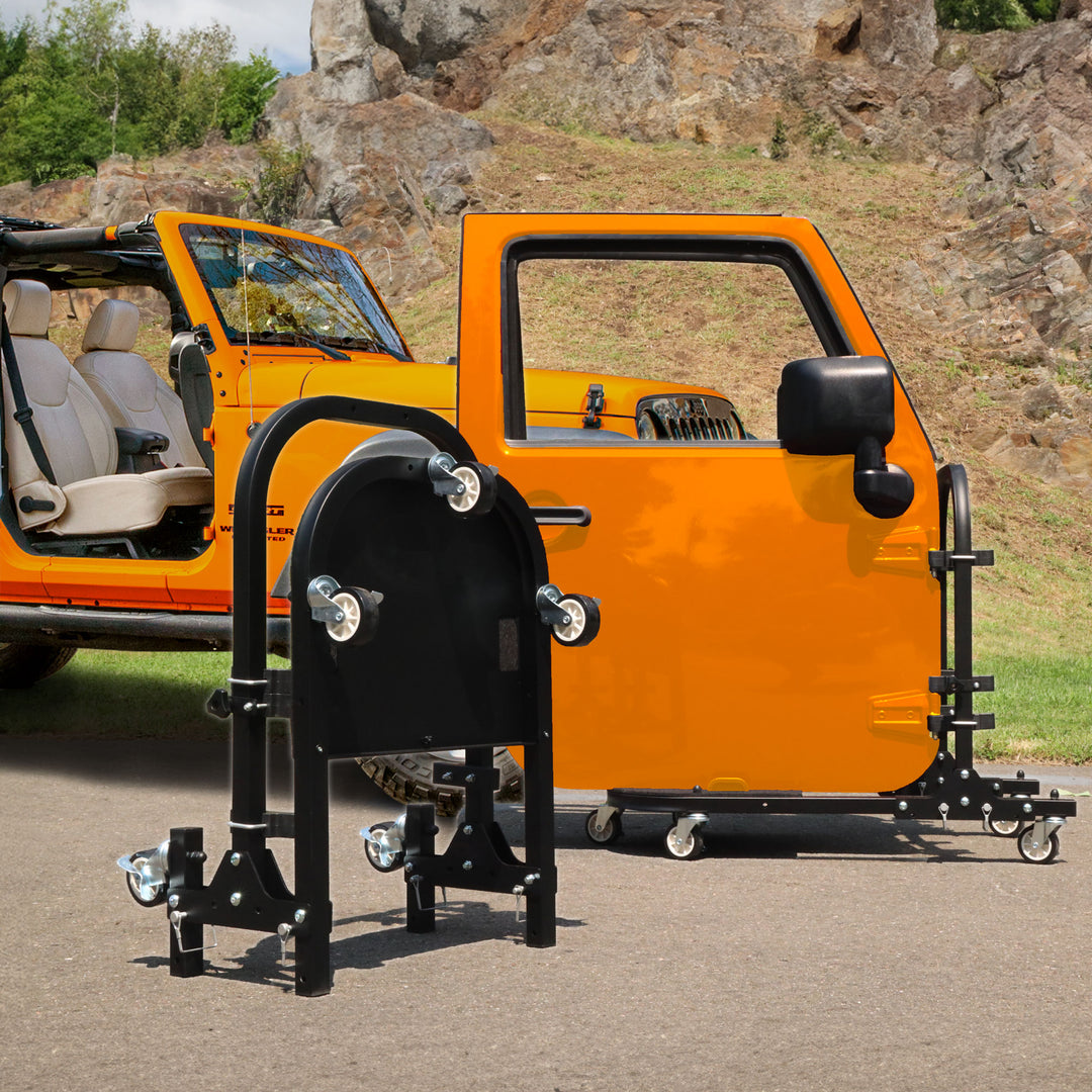 EZ4X4 black folding rolling door cart beside orange Jeep with two doors; second cart folded for compact storage.