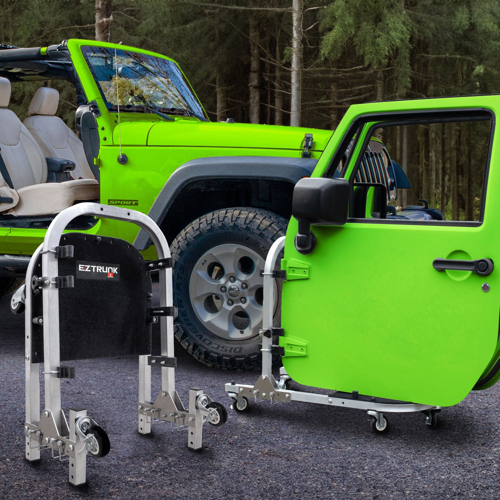 Green Jeep Wrangler with doors on EZ4X4 aluminum door cart; second cart folded to show compact, space-saving storage.