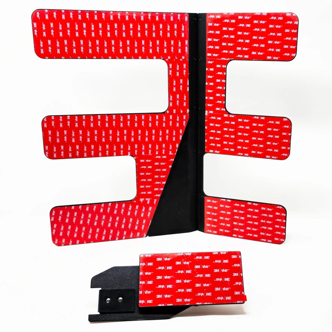 Close-up of 3M red backing on black EZ FlipTop hinge, showing strong adhesive for secure, durable Jeep roof panel install.