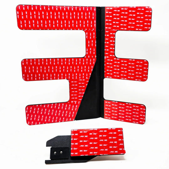 Close-up of 3M red backing on black EZ FlipTop hinge, showing strong adhesive for secure, durable Jeep roof panel install.