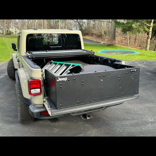 EZ4X4 Bed Box used as trunk extender in closed position with gear inside Jeep Gladiator JT, showing secure storage solution.