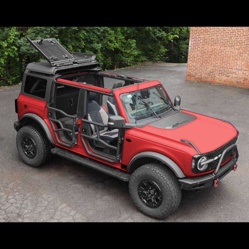 Ford Bronco with roof rack system and flip-top panels open, showcasing easy access and versatile off-road functionality.