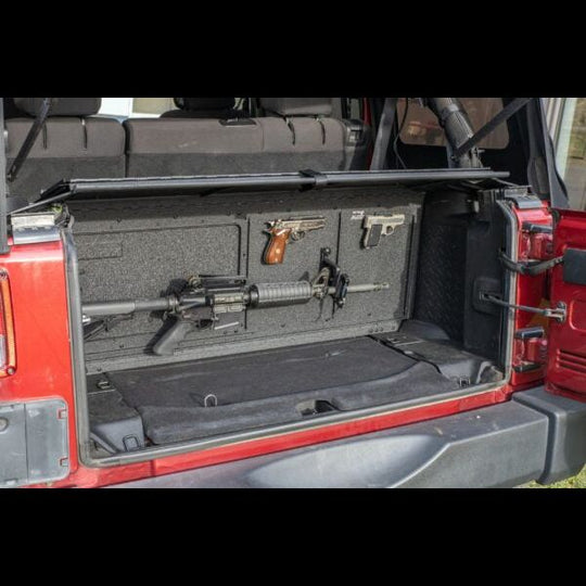 Magnetic gun holder securing firearms in Jeep trunk, showcasing safe and discreet storage for off-road or travel use.
