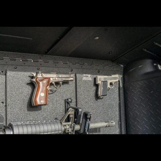 Magnetic gun holder securing firearms in Jeep trunk, showcasing safe, durable, and discreet storage for travel use.
