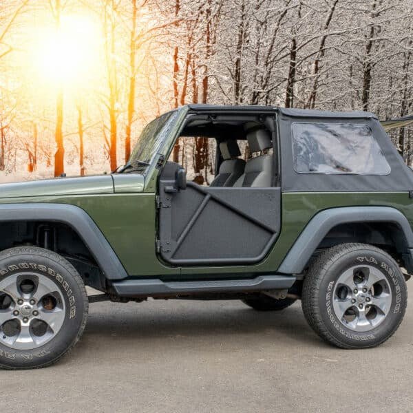Photo 1: Green Jeep with black Phantom aluminum doors and all-weather panels, offering rugged off-road protection.