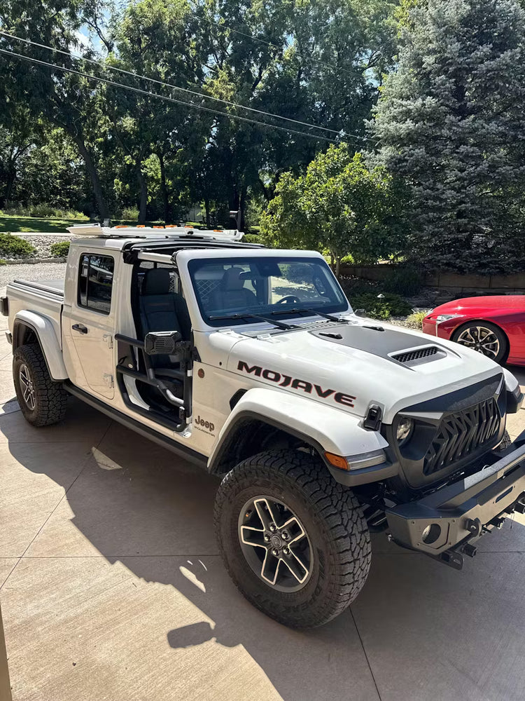 White Jeep JT Gladiator Mojave in a driveway with EZ4X4 Alpha Aluminum Tube Doors and EZ4X4 EZ FlipTop installed.