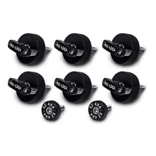 Close-up of six large, black EZ4X4 Quick Release Thumb Screws with integrated D-rings, alongside two smaller, circular thumb screws, isolated on a white background.