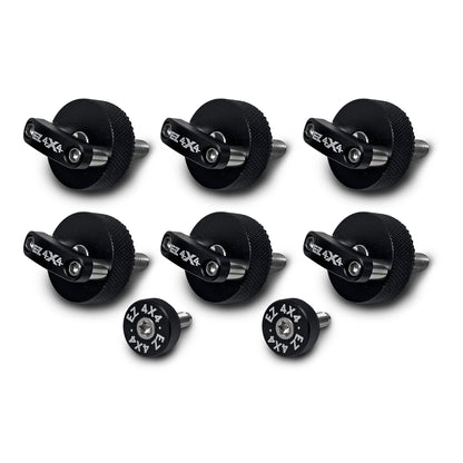 Close-up of six large, black EZ4X4 Quick Release Thumb Screws with integrated D-rings, alongside two smaller, circular thumb screws, isolated on a white background.
