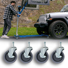 Man rolling EZ4X4 Hard Top Remover Lift with a Jeep hard top lifted, with a set of 4 5-inch caster wheels shown below.