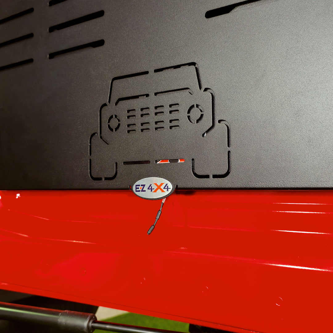 Close-up of the spring-loaded pull tab accessory and vehicle cutout on the EZ4X4 Extreme Tailgate Table for Ford Bronco.