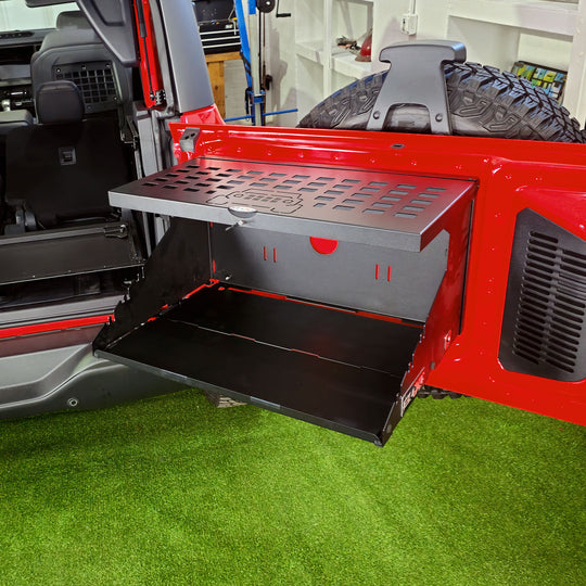 EZ4X4 Extreme Bronco tailgate table with MOLLE top fully opened and empty, showing the full table surface.