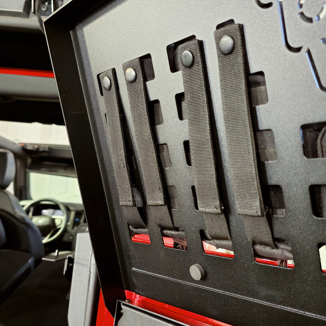 Underside of the EZ4X4 Extreme Bronco tailgate table MOLLE top showing snap-in MOLLE straps secured in place.