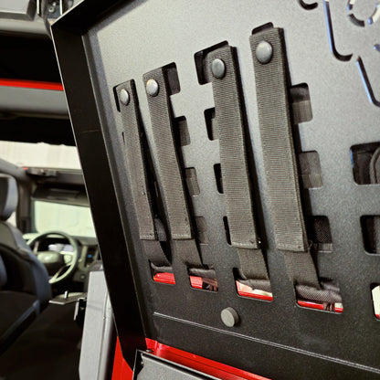 Underside of the EZ4X4 Extreme Bronco tailgate table MOLLE top showing snap-in MOLLE straps secured in place.