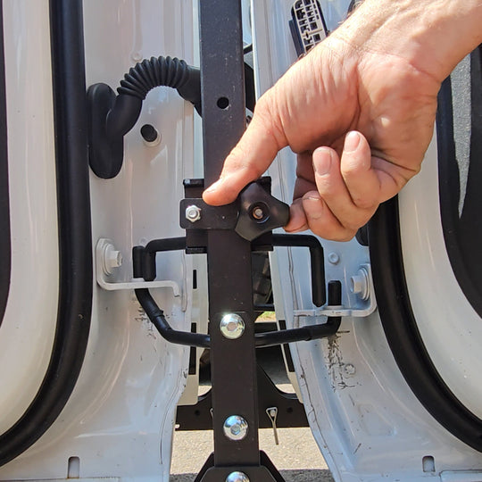 Close-up of EZ4X4 door lock mechanism on cart, showing doors securely locked in place for safe storage and transport.
