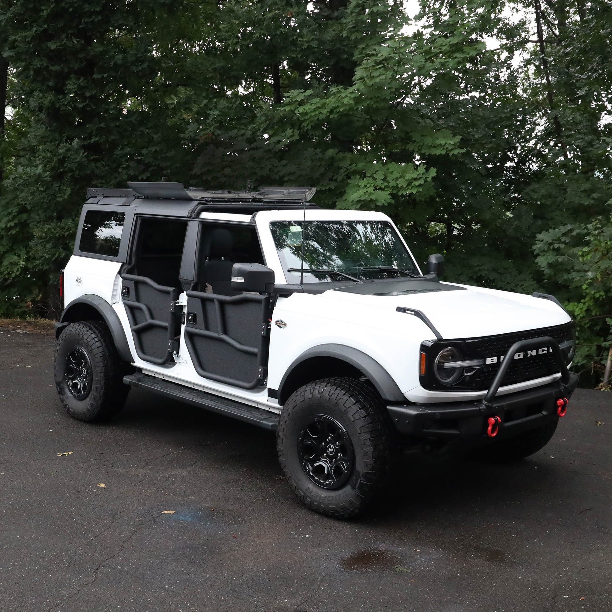 White Ford Bronco with flip-top panels and Phantom doors, showing quick install and rugged, off-road-ready design.