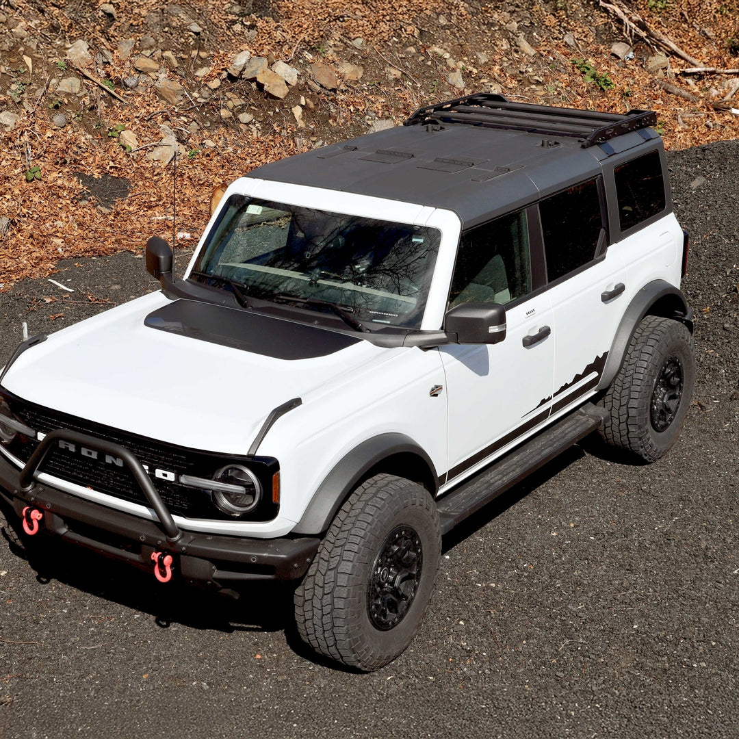 White Ford Bronco with an EZ4X4 Middle Panel Roof Rack Holder installed on the hardtop.