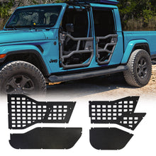 Blue Jeep Gladiator (JT) equipped with EZ4X4 Alpha Tube Doors, with a MOLLE panel set displayed in the foreground.