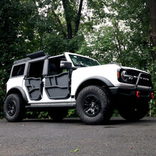 White Ford Bronco equipped with EZ4X4 Alpha Tube Doors and all-weather panels.
