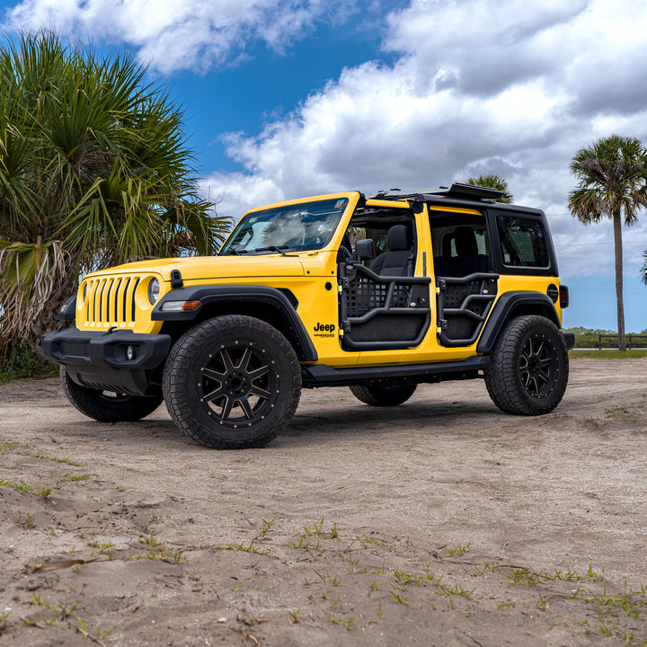 Yellow 4-door Jeep with Alpha tube doors and all-weather panels, showing durable, off-road-ready protection.