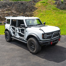 White four-door Ford Bronco with color-matched Alpha Tube Doors.