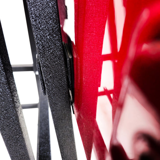 Close-up of red Jeep doors resting on EZ4X4 Door Lift, showing secure, protective storage for vehicle doors.