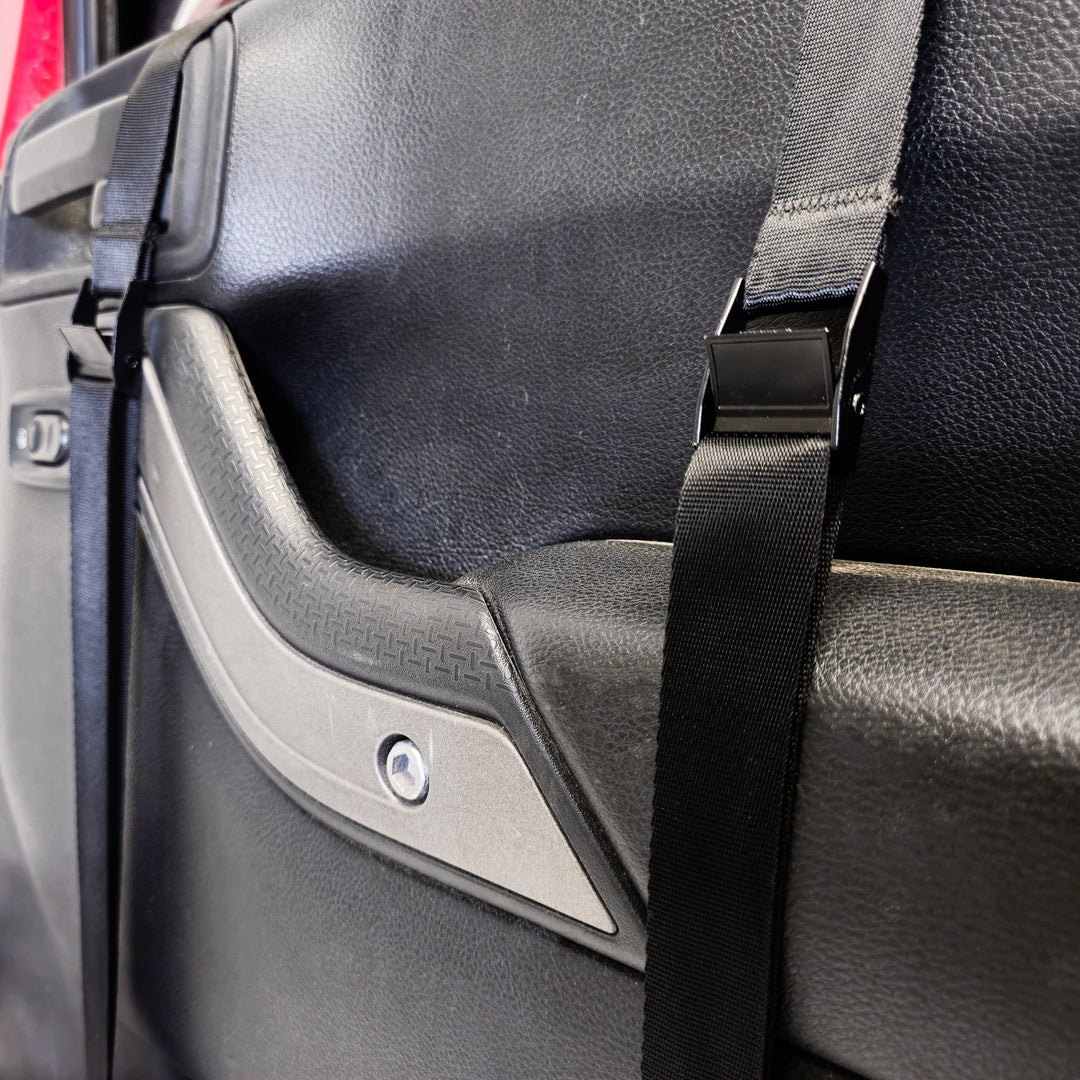 Close-up of EZ4X4 Door Lift straps securing door in place, showing protective design that prevents damage.