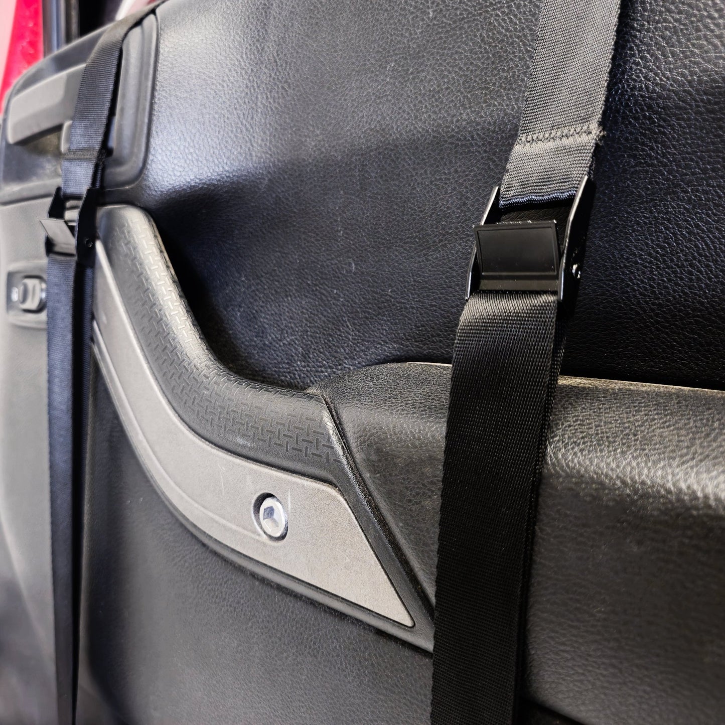 Close-up of EZ4X4 Door Lift straps securing door in place, showing protective design that prevents damage.