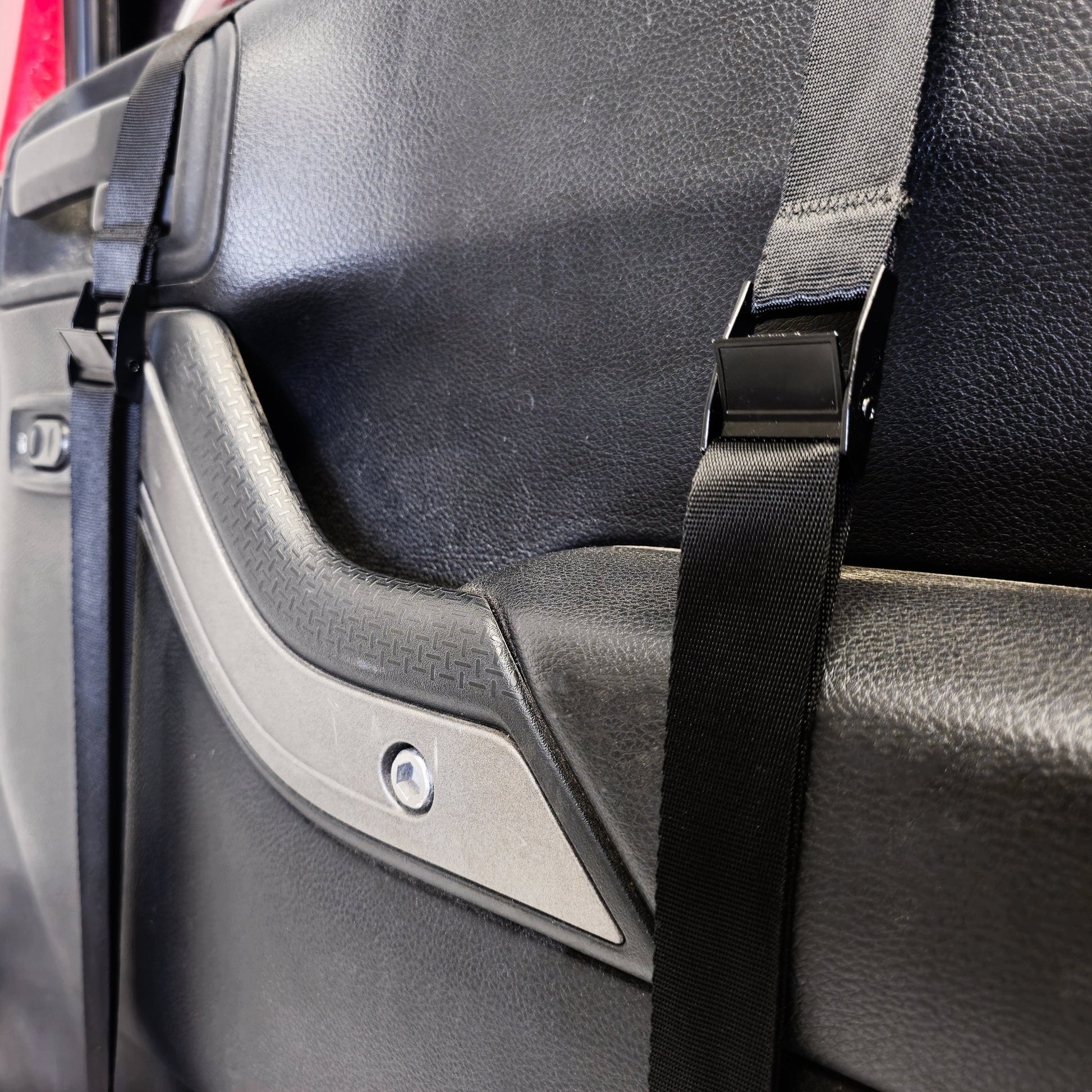Close-up of EZ4X4 Door Lift straps securing door in place, showing protective design that prevents damage.