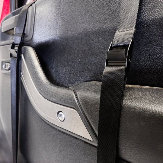 Close-up of EZ4X4 Door Lift straps securing door in place, showing protective design that prevents damage.