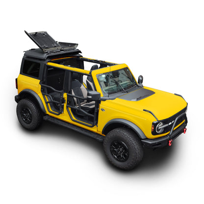 Yellow Ford Bronco with black EZ4X4 FlipTop roof rack system in open position, angled view on a white background.