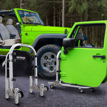 Green Jeep Wrangler with doors on EZ4X4 aluminum door cart; second cart folded to show compact, space-saving storage.