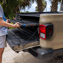 Pull-out sliding trunk shelf in Jeep Gladiator, showing smooth extension and easy access to stored gear and cargo.