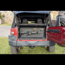 Gun mount securing firearms in Jeep trunk, showing safe, durable, and discreet storage for travel and off-road use.