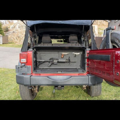 Gun mount securing firearms in Jeep trunk, showing safe, durable, and discreet storage for travel and off-road use.