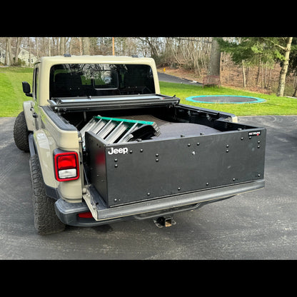 EZ4X4 Bed Box used as trunk extender in closed position with gear inside Jeep Gladiator JT, showing secure storage solution.