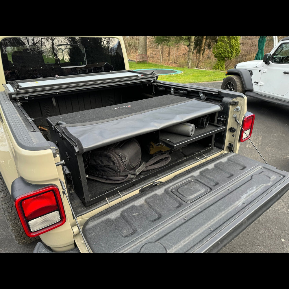 EZ Quickbox in truck bed filled with gear, showing lockable, organized storage and rugged cargo protection.