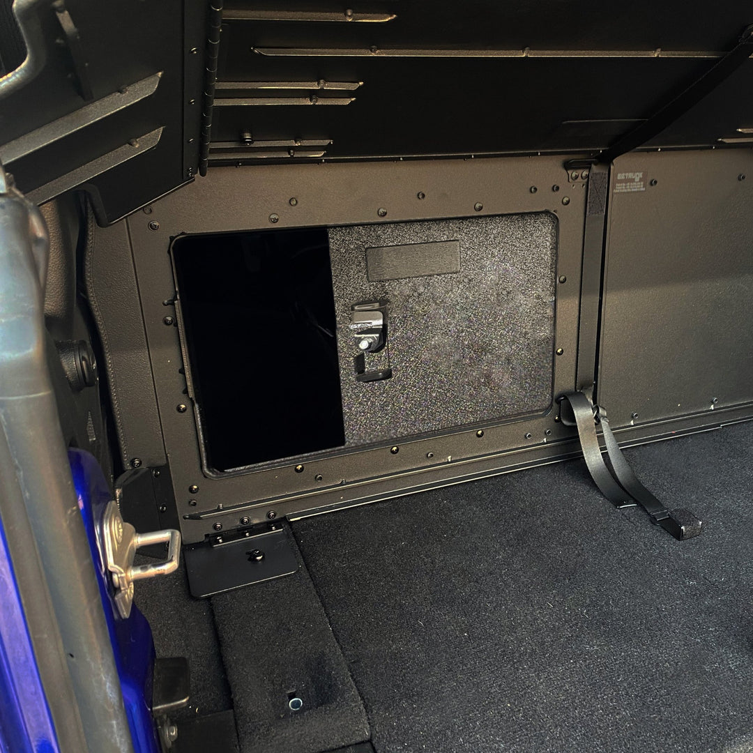 Interior view of EZTrunk with sliding door and lock, showing secure, organized storage for Jeep cargo areas.