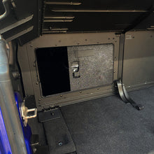 Interior view of EZTrunk with sliding door and lock, showing secure, organized storage for Jeep cargo areas.