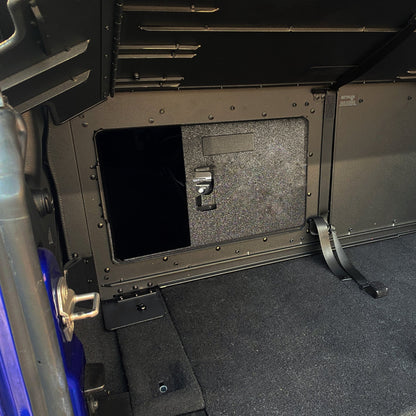 Interior view of EZTrunk with sliding door and lock, showing secure, organized storage for Jeep cargo areas.