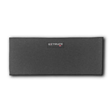 Black rectangular EZTrunk carpet shown on white background, highlighting sleek design and branded aftermarket cargo storage.
