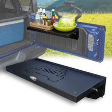 Black foldable tailgate table mounted on Jeep and shown solo, highlighting portable, trail-ready gear for camping use.