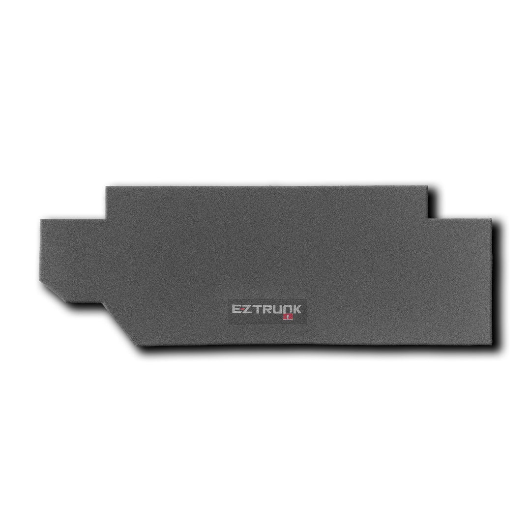 Black rectangular EZTrunk carpet for TJ shown on white background, highlighting sleek design and branded aftermarket cargo storage.