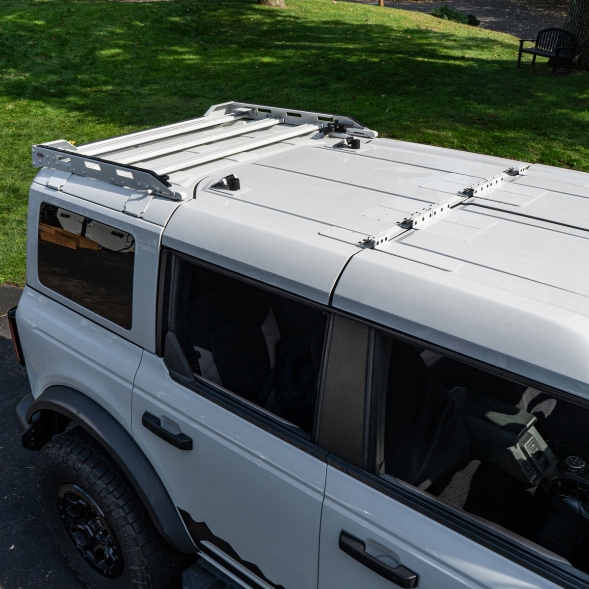 Color-matched EZ FlipTop and Roof Rack installed on a white four-door Ford Bronco.