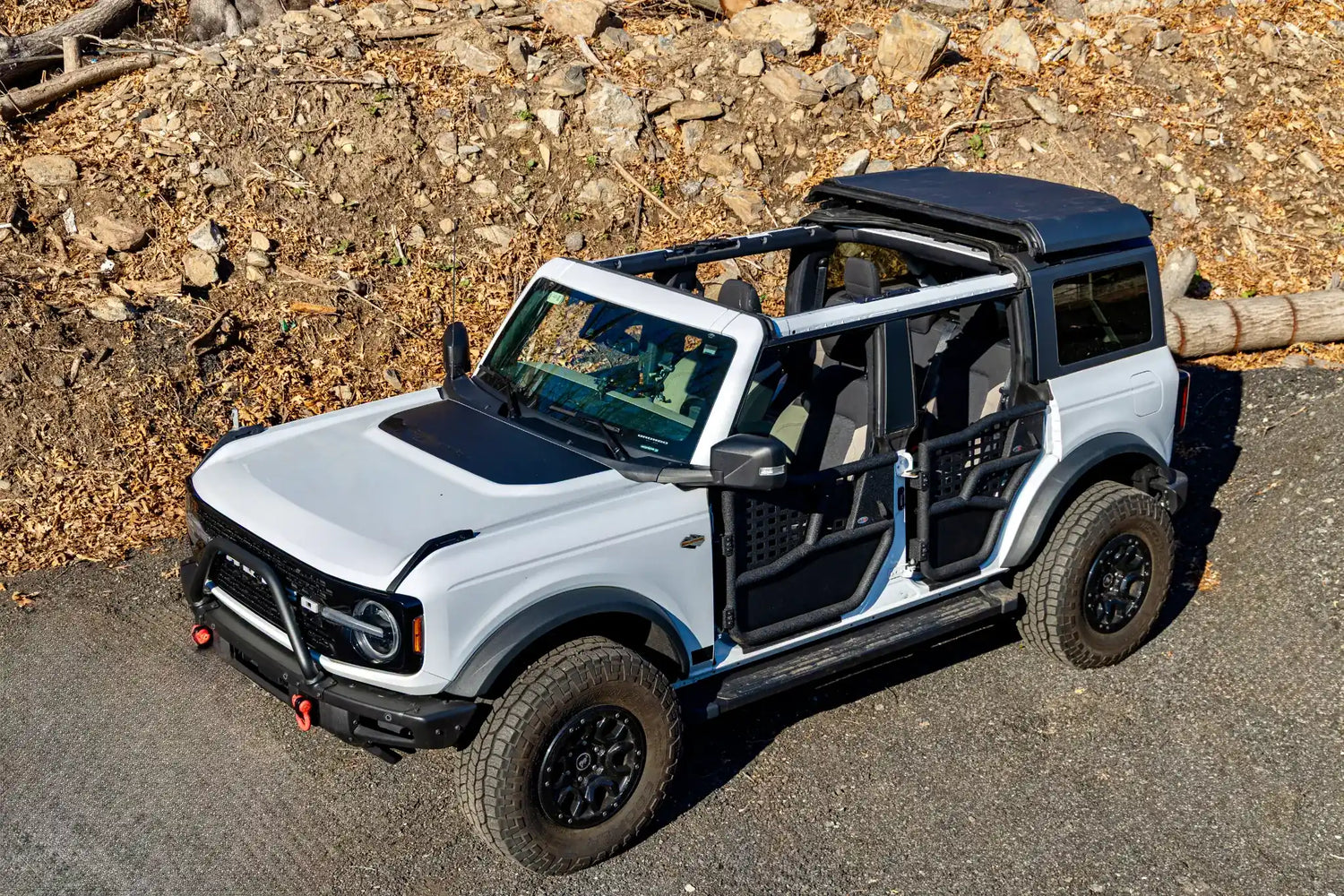 White Ford Bronco with EZ4X4 Alpha Tube Doors with MOLLE Panels and Middle Panels secured with the Middle Panel Roof Rack Holder.